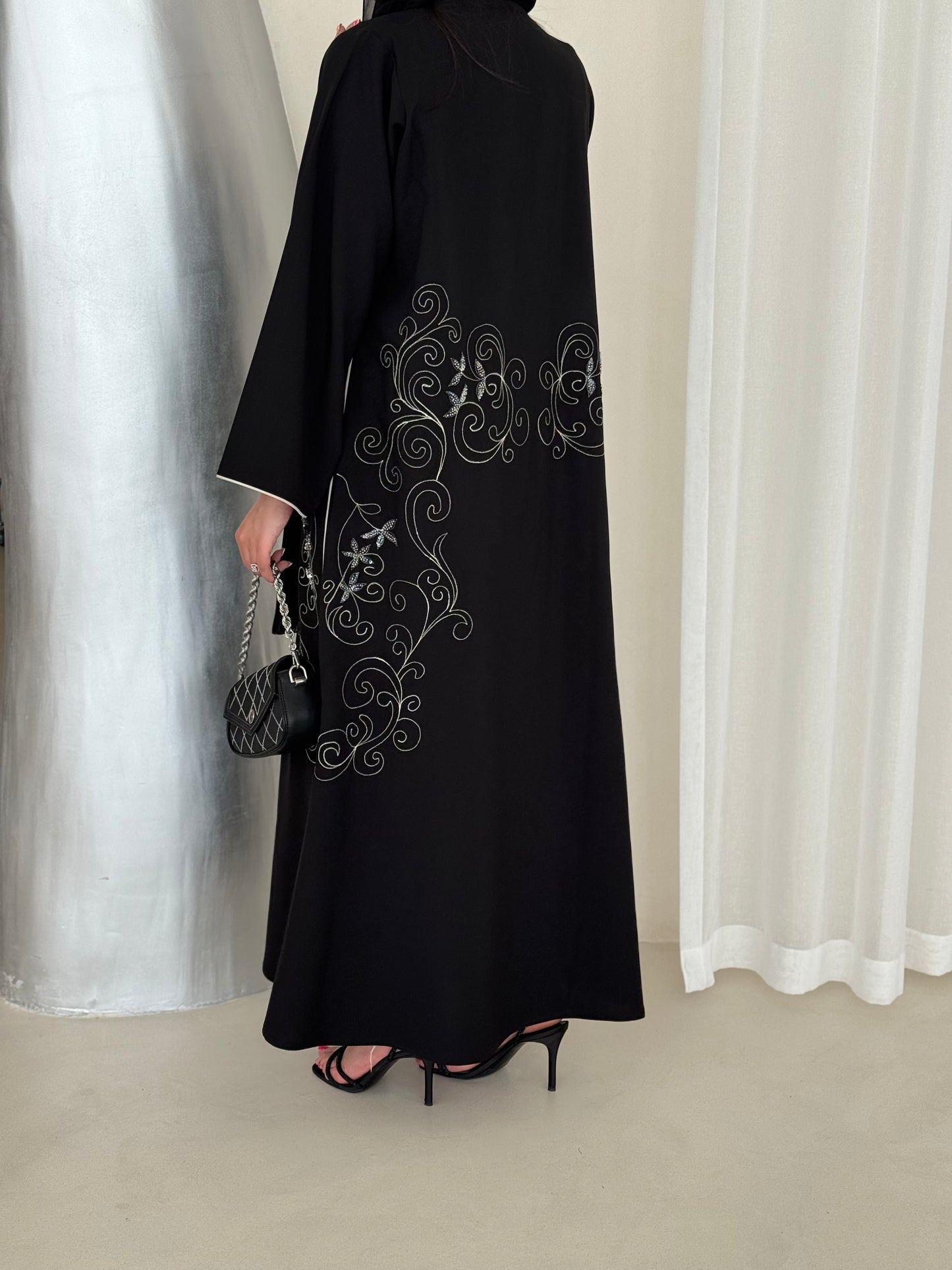 An elegant abaya adorned with intricate embroidery