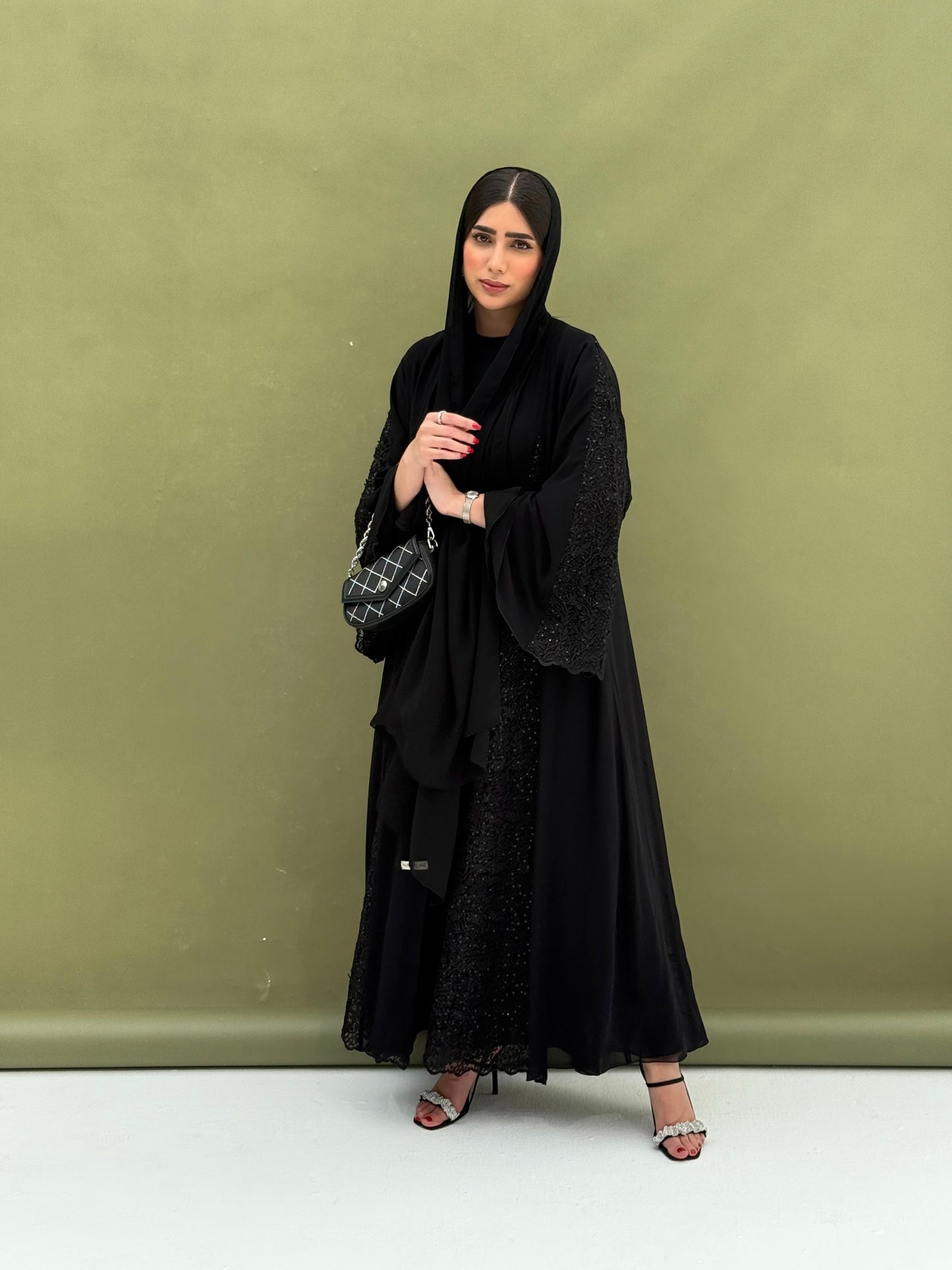 A full black, flowy abaya with a luxurious feel