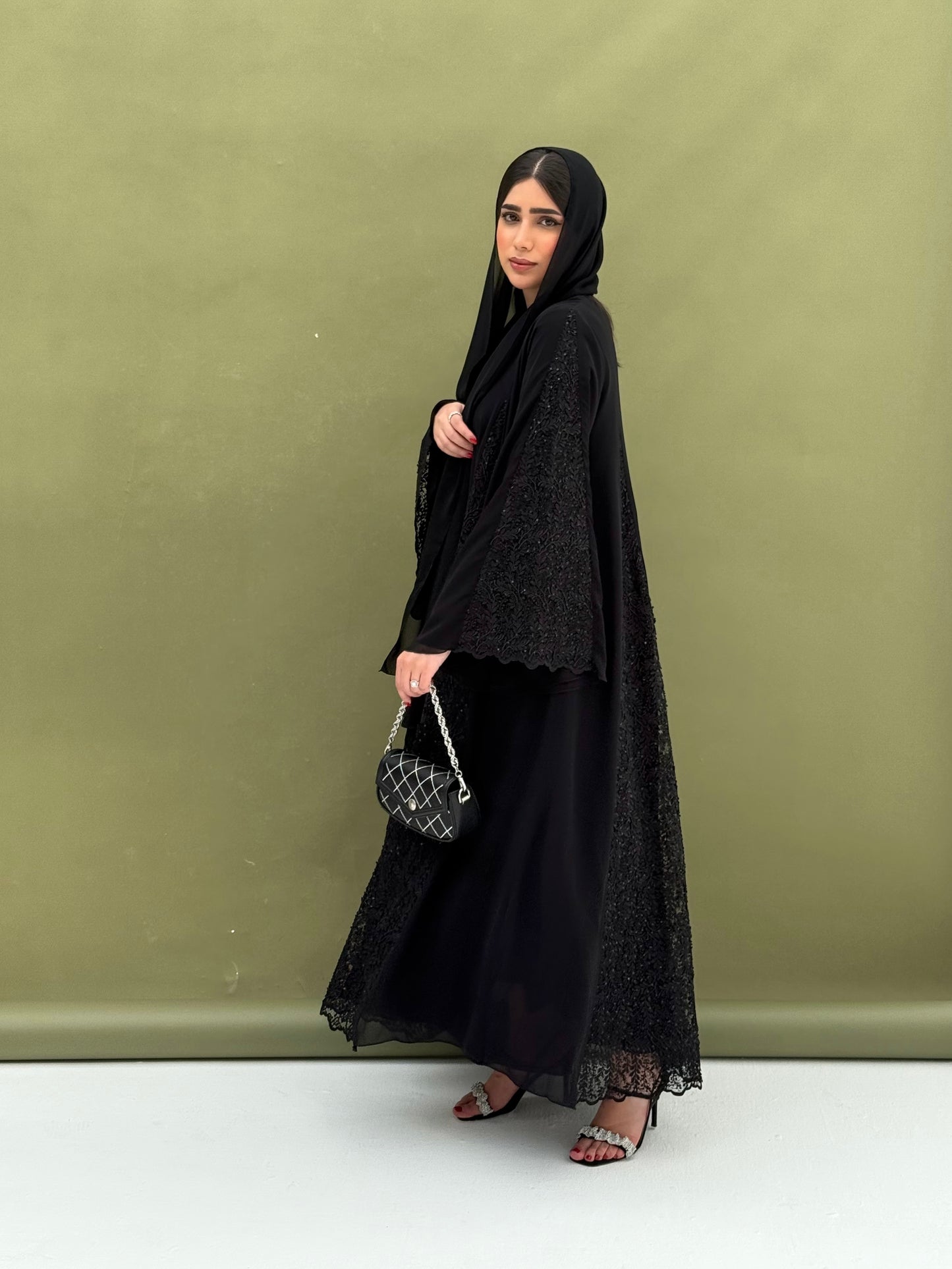 A full black, flowy abaya with a luxurious feel