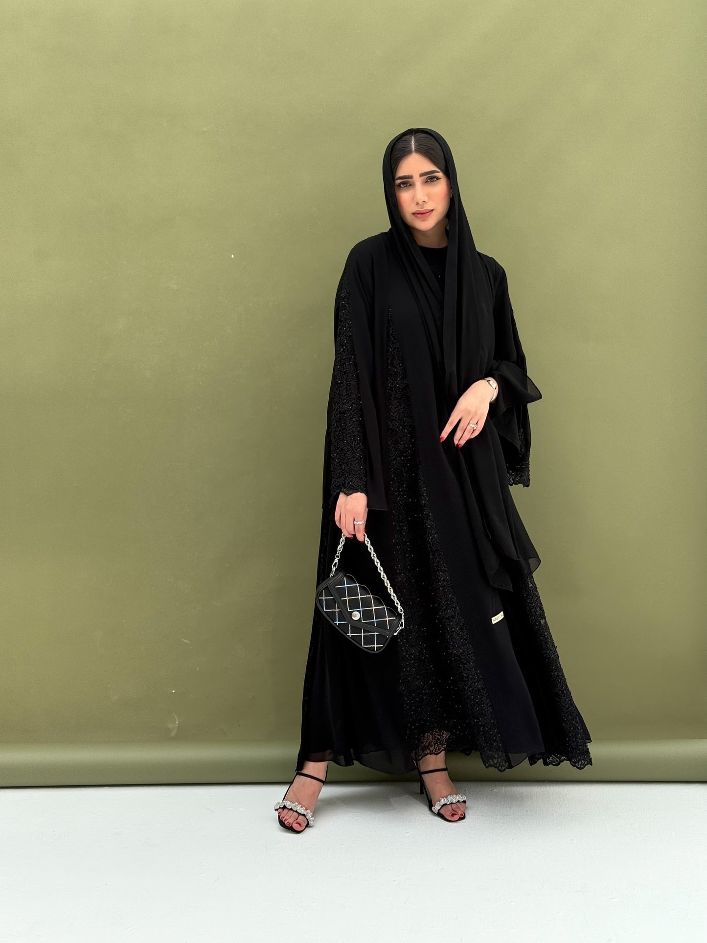 A full black, flowy abaya with a luxurious feel