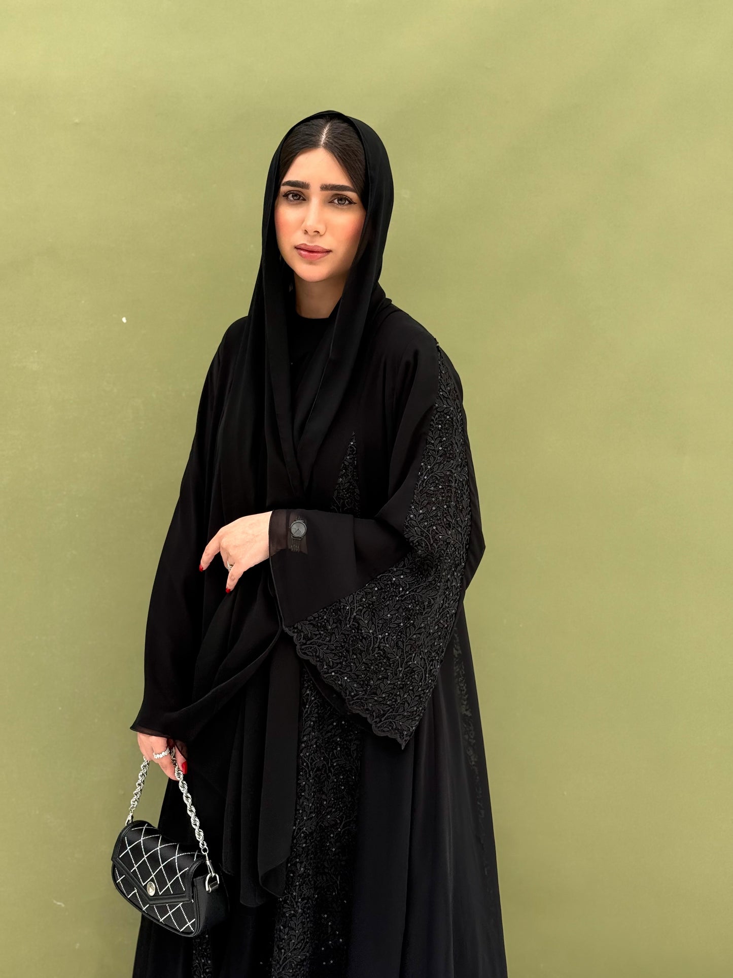 A full black, flowy abaya with a luxurious feel