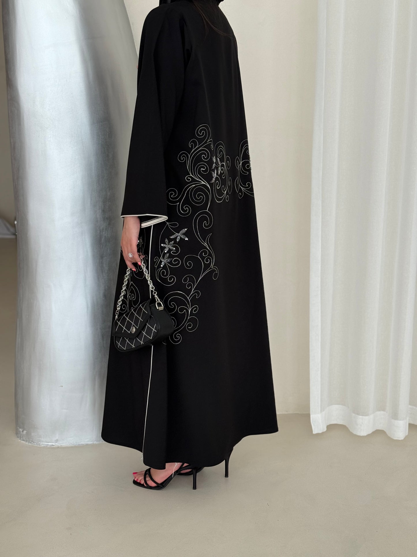 An elegant abaya adorned with intricate embroidery