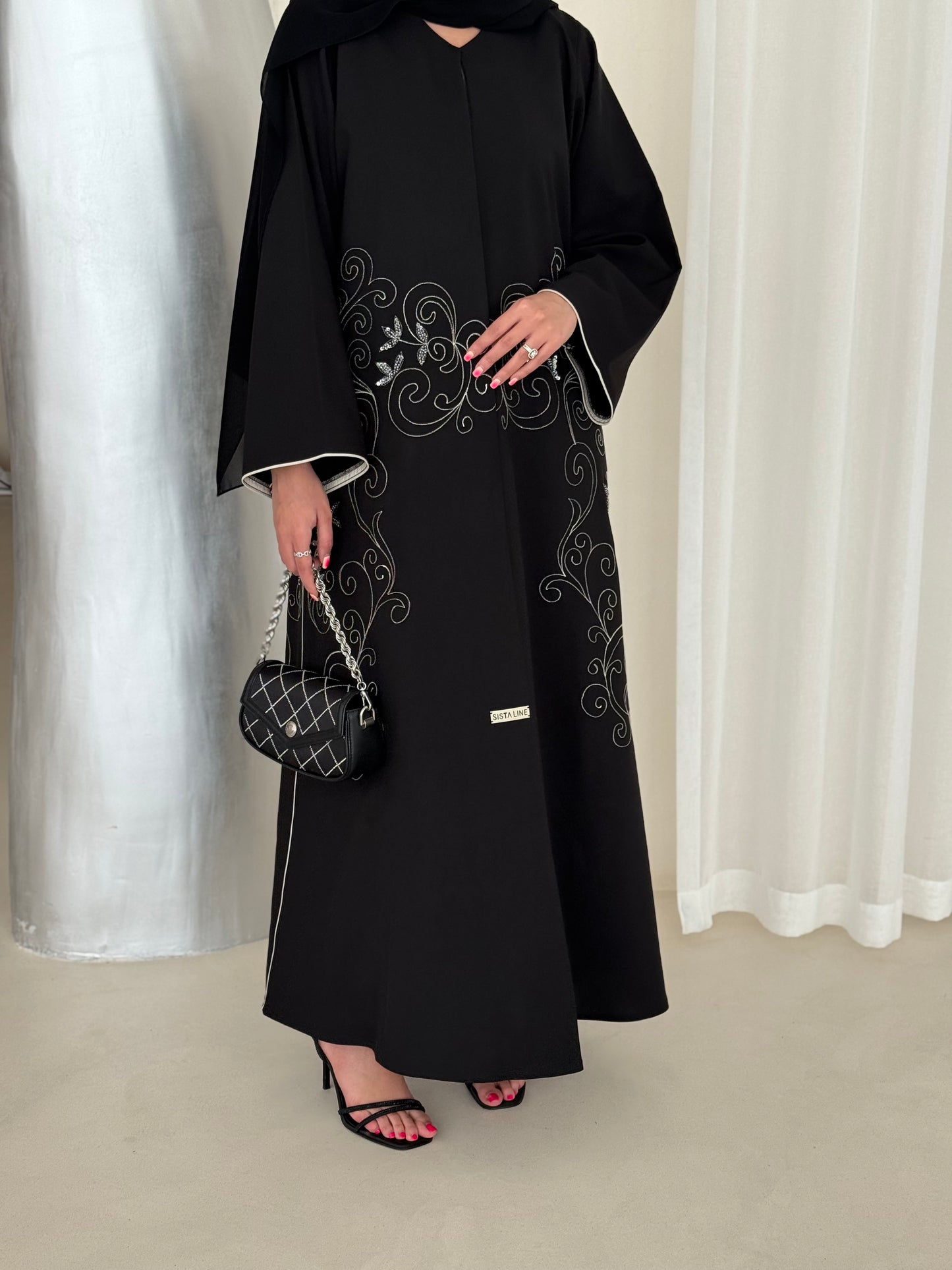 An elegant abaya adorned with intricate embroidery