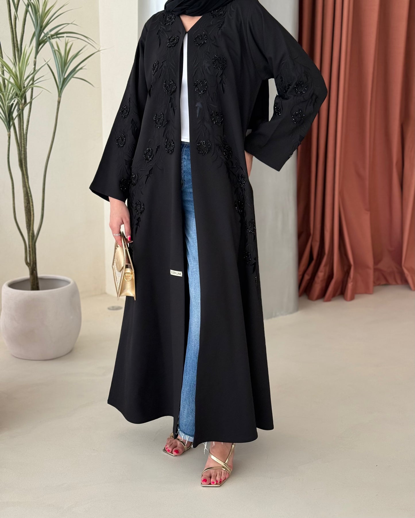 Black abaya featuring exquisite handwork