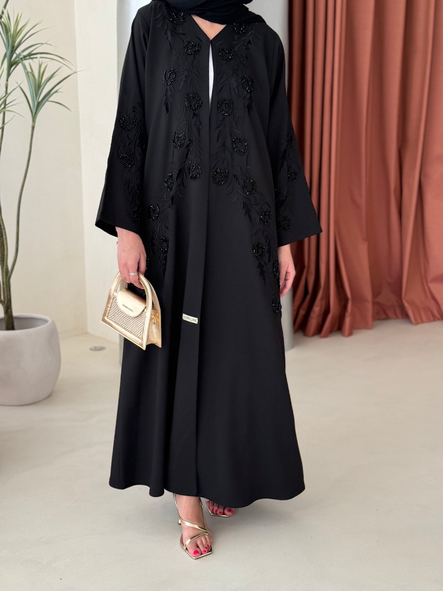 Black abaya featuring exquisite handwork