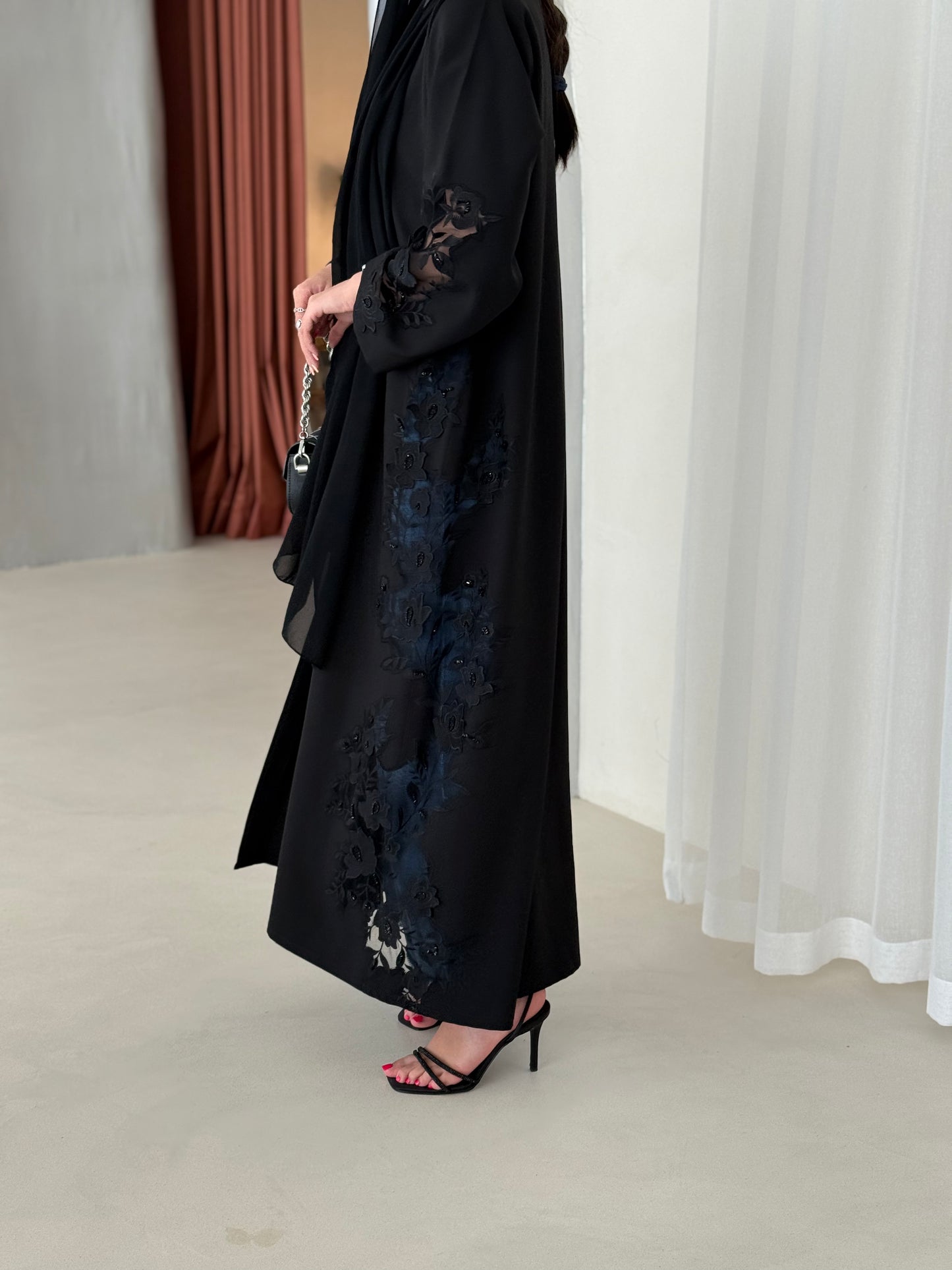 A full black abaya with a Klosh cut