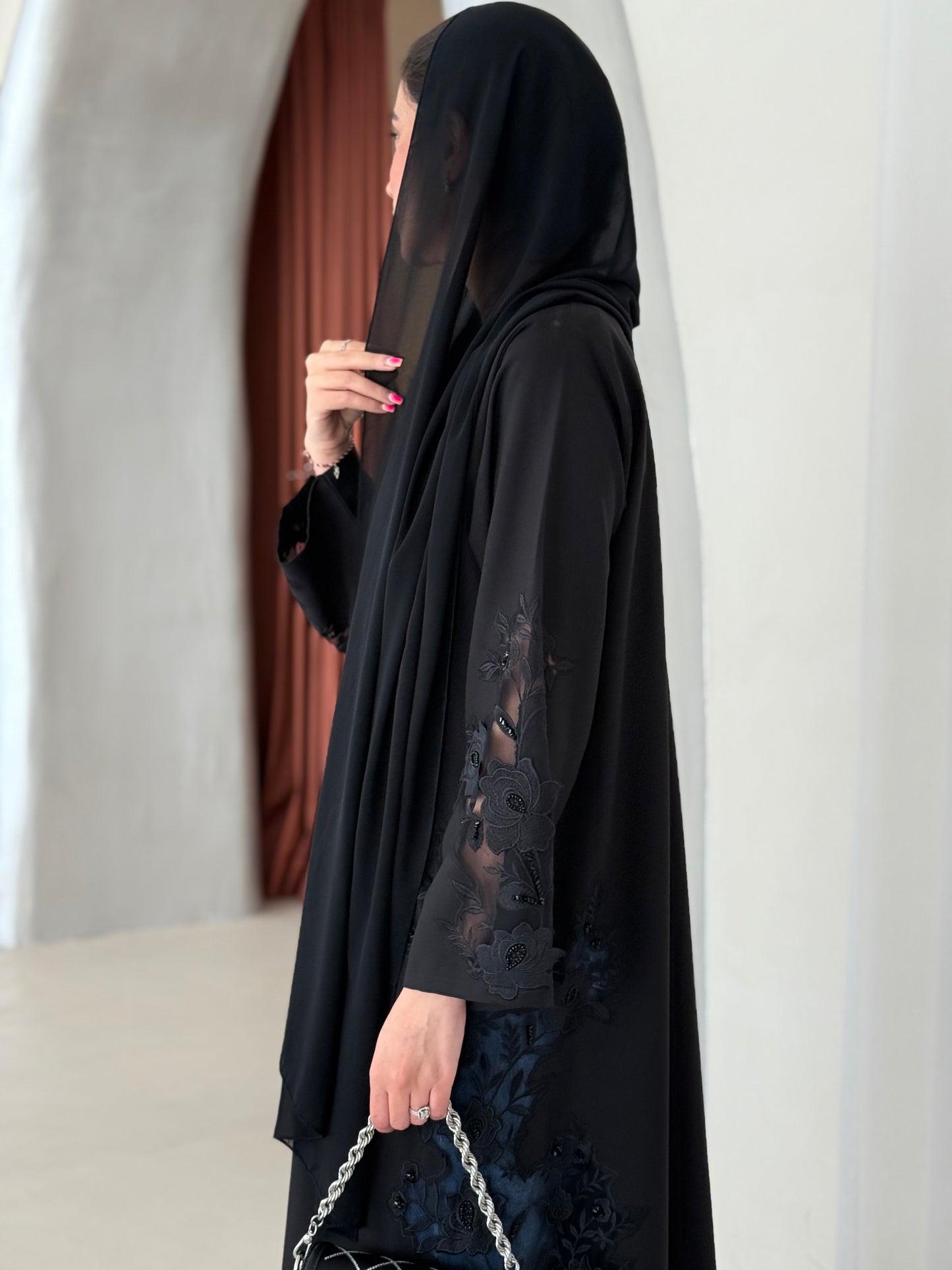 A full black abaya with a Klosh cut