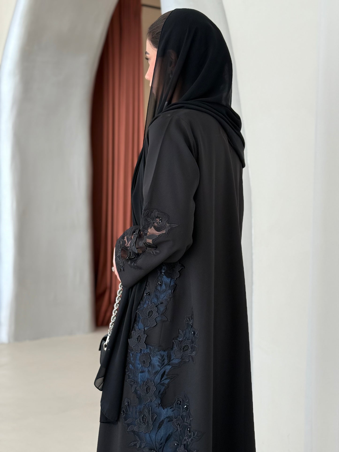 A full black abaya with a Klosh cut