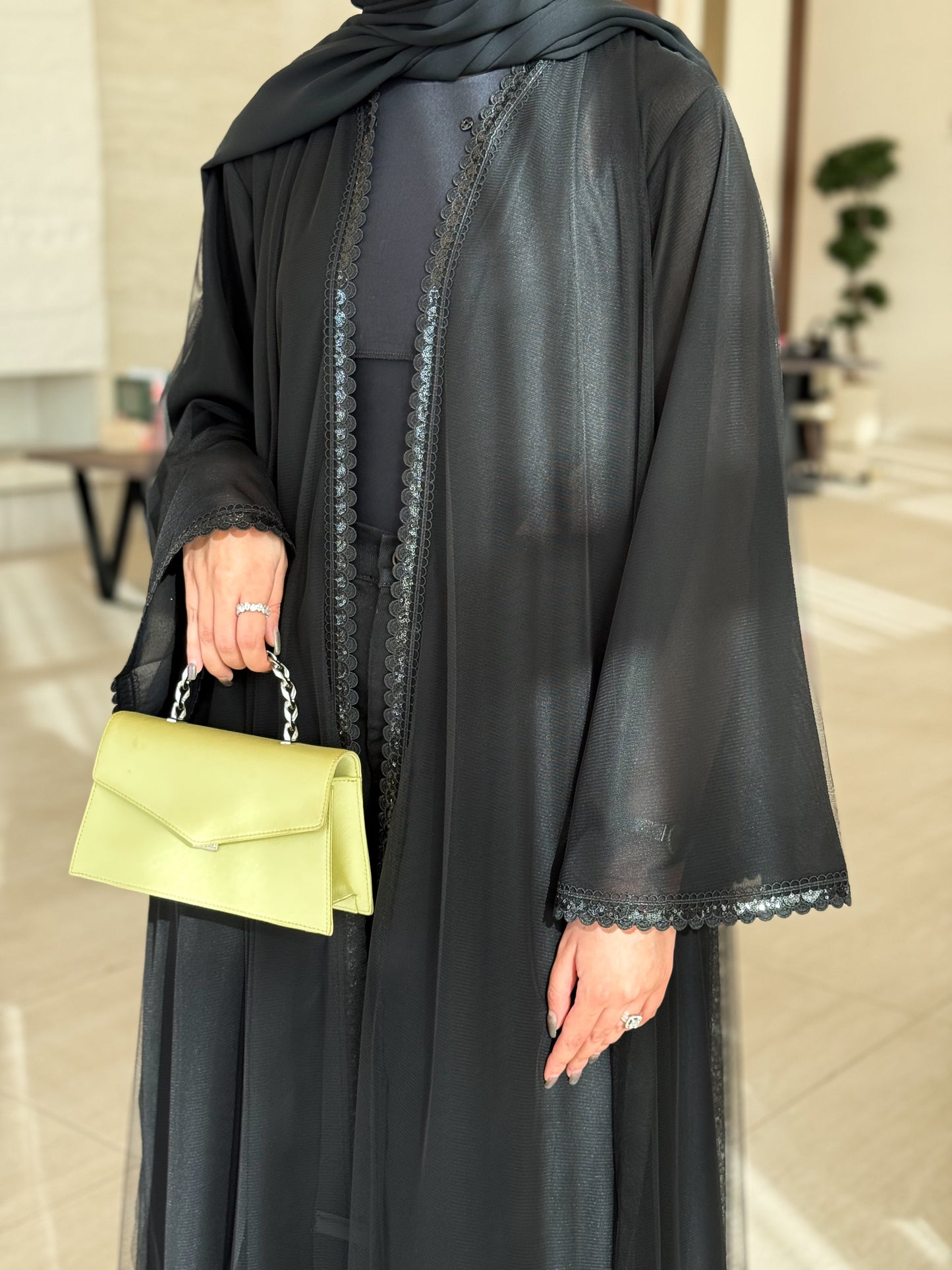 An elegant abaya featuring unique tailoring