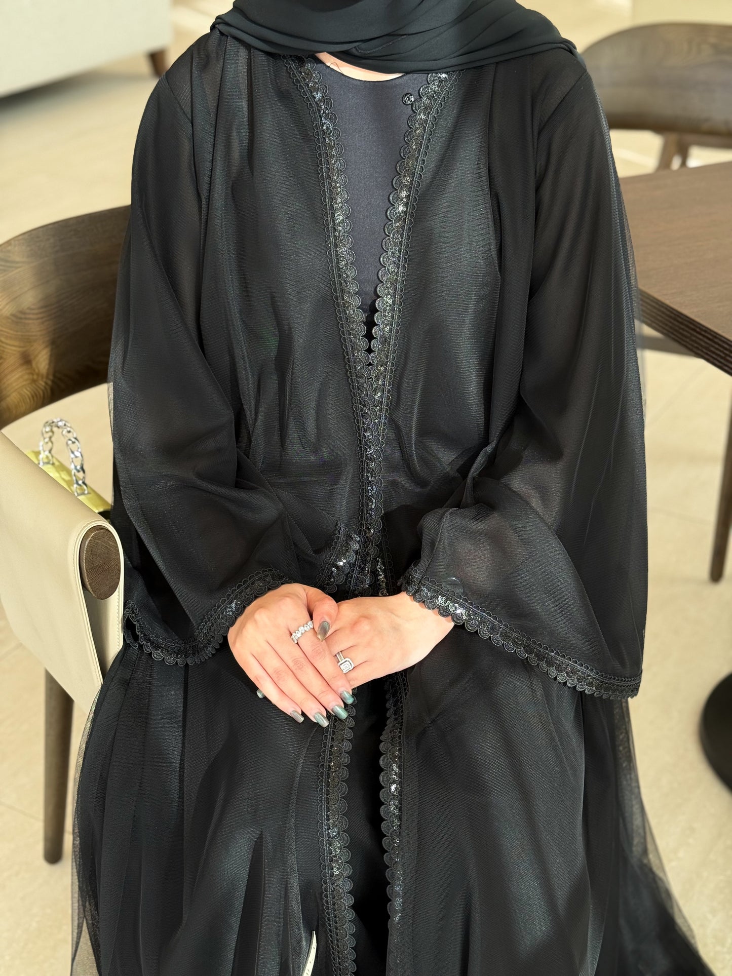 An elegant abaya featuring unique tailoring