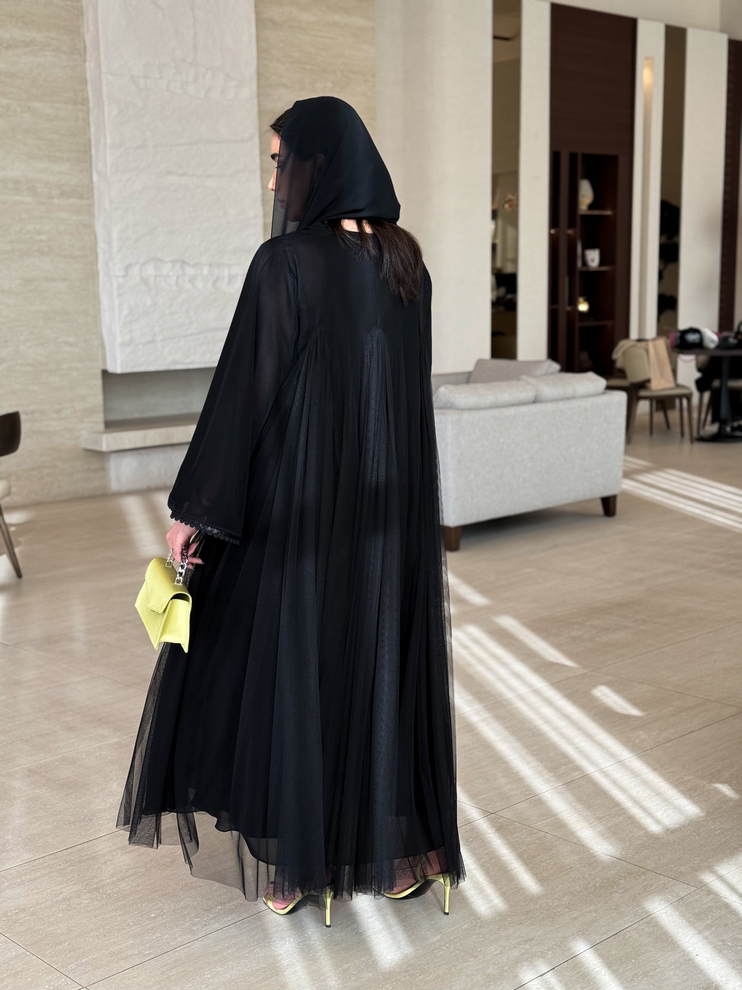 An elegant abaya featuring unique tailoring